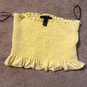 Forever 21 light yellow smocked tube top. Size L